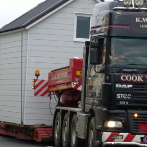 Relocating a house using a flatbed truck