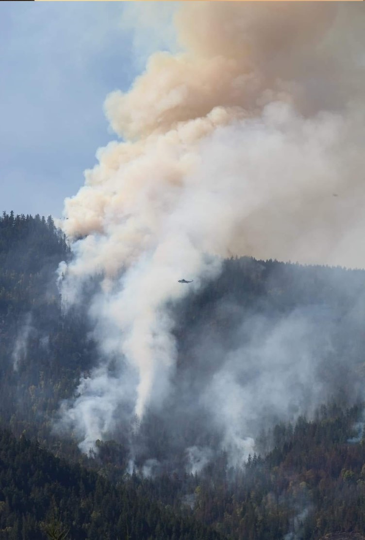 Plumes of smoke - Kelowna area. Note helicopter.