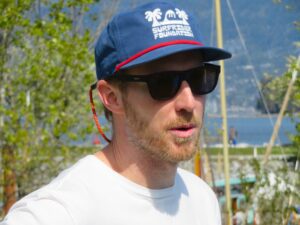 Johnny Rodgers, chair of Surfrider Vancouver cleaning up beach for Earth day