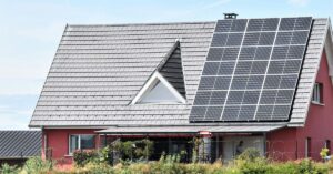 image depicting solar panels on residential home relates to young climate champion Mario Kohle