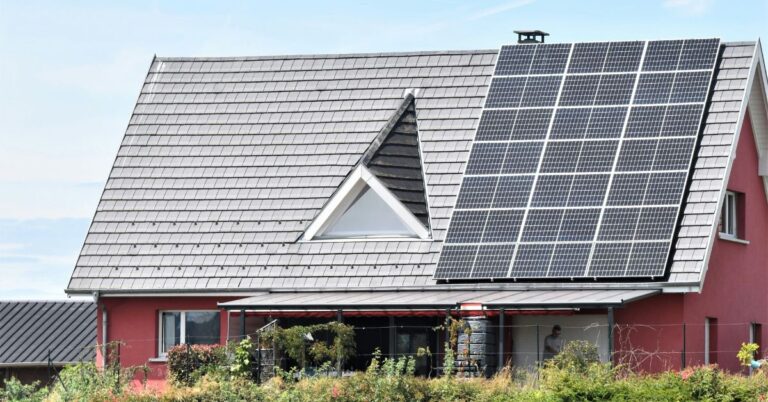 image depicting solar panels on residential home relates to young climate champion Mario Kohle